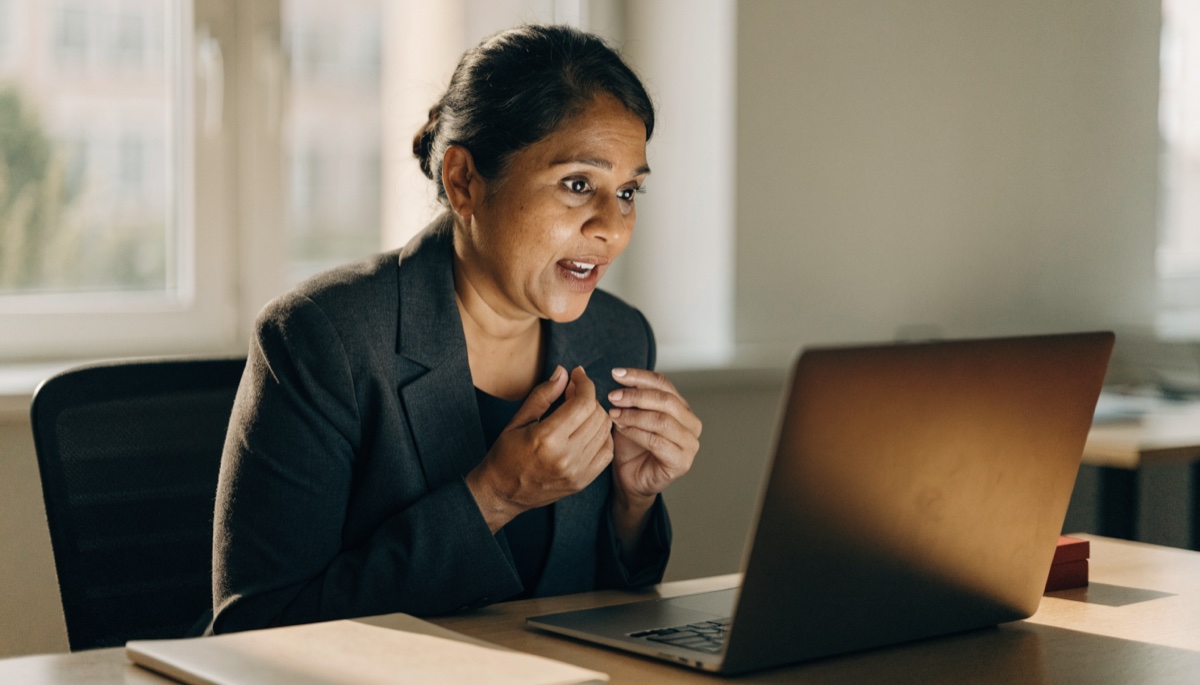 A regulated immigration consultant reviewing a client situation across a desk