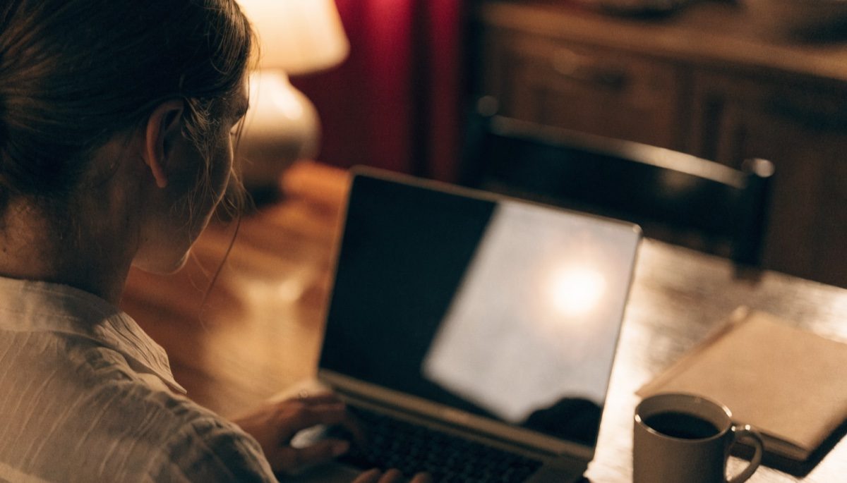 Applicant completing an online form at a desk